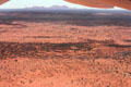 The Olgas near Uluru & red earth surrounding them, seen from air. Australia
