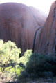 Sun shines over saddle of Uluru. Australia.