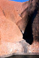 Pond under water sculpted rocks of Uluru. Australia.