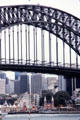 Sydney Harbour Bridge frame highrises & an amusement area Sydney. Sydney, Australia.