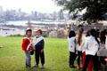 Children playing convicts & guards, an essential part of Australian heritage, on Observatory Hill. Sydney, Australia.