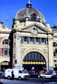 Lavish stone facade & copper dome of Melbourne's Flinders Station. Melbourne, Australia.