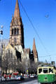 St Paul's Cathedral with streetcar on Swanston Street. Melbourne, Australia.