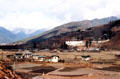 Overview of Paro with large temple Rinpung Dzong & national museum high on hill. Bhutan.