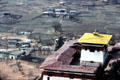 Rooftop view of Rinpung Dzong & a traditional covered bridge in Paro. Bhutan.