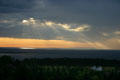 Light streams through clouds over Bay of Fundy. NB.