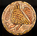 Earthenware bowl with underglaze slip-painting bird from Northern Iran at Aga Khan Museum. Toronto, ON.
