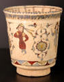 Fritware beaker with painting of dancing women from Iran at Aga Khan Museum. Toronto, ON.