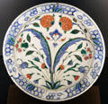 Fritware dish painted with flowers from Iznik, Turkey at Aga Khan Museum. Toronto, ON.