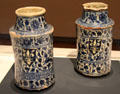 Fritware pair of pharmacy jars painted with European armorial shields from Syria at Aga Khan Museum. Toronto, ON.