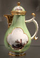 Meissen porcelain coffee pot decorated in green with European scenes in white quatrefoils at Gardiner Museum. Toronto, ON.