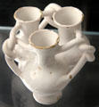 Fuddling cup of white English delftware from. London at Gardiner Museum. Toronto, ON.