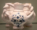 Fuddling cup with blue star on white English delftware from. London at Gardiner Museum. Toronto, ON.