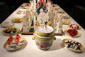 Porcelain dessert table setting by Derby around Sevres centerpiece at Gardiner Museum. Toronto, ON