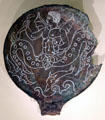 Etruscan bronze mirror back depicting giant sea creatures at Royal Ontario Museum. Toronto, ON.