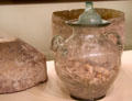 Glass urn with cremated ashes & ceramic outer container from Ventimiglia, Italy at Royal Ontario Museum. Toronto, ON.