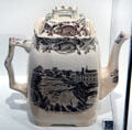 Earthenware teapot with transfer-print of Lorette Falls, Quebec by Britannia Pottery of Glasgow, Scotland at Royal Ontario Museum. Toronto, ON.