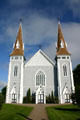 100 ft twin spires of St. John the Baptist Church. Miscouche, PE.