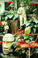 Stone sculptures, vegetation and birds decorate the interior of the Don Carlos Hotel in San José. Costa Rica.