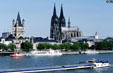 Skyline from Deutzer Bridge over Rhine with towers of Gross St. Martin church & Cologne Cathedral. Köln, Germany.