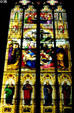 Stained glass windows of Cologne Cathedral showing descent from Cross over row of four Apostles. Köln, Germany.