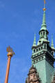 City Hall spire & sailing ship atop flagpole representing city's maritime history. Hamburg, Germany.