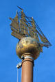 Sailing ship atop flagpole representing city's maritime history on Hamburg City Hall plaza. Hamburg, Germany.