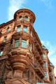 Turret on Victorian Romanesque red stone Hamburger Hof building on Jungfernstieg. Hamburg, Germany.