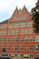 Ornate roofline of Hanseatic brickwork style university building on Holstenwall. Hamburg, Germany.