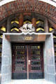 Entrance to Chilehaus capped by sculpture of sailing ship. Hamburg, Germany.