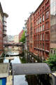 Older & modern buildings lining canal. Hamburg, Germany