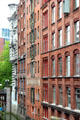 Facades of former commercial buildings along canal. Hamburg, Germany.