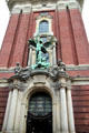 St. Michael's Victory over the Devil sculpture above the main entrance to St. Michael's Church. Hamburg, Germany.