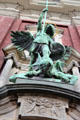 St Michael's Victory over the Devil sculpture above the main entrance to St Michael's Church. Hamburg, Germany.