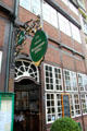 Street sign for historic pub. Hamburg, Germany.