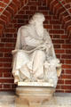 Statue of Evangelist, St Luke, with his attribute bull, at entrance to St Peter's Church. Hamburg, Germany.