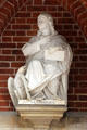 Statue of Evangelist, St John, with his attribute eagle, at entrance to St Peter's Church. Hamburg, Germany.