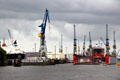 Elbe River shipyard against a cloudy sky. Hamburg, Germany.