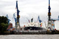 Ship in drydock at Elbe River shipyard. Hamburg, Germany.