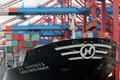 Container ship, Hanjin United Kingdom, being unloaded via cranes at container port. Hamburg, Germany.