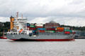 Container ship, Bjorg, St. John's, with life boat & slide, traveling along Elbe River. Hamburg, Germany.