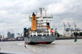 Container ship, Bjorg, St. John's, traveling past container port. Hamburg, Germany.