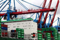 Cranes moving containers at container port. Hamburg, Germany.