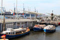 Tour boats docked at St. Pauli Pier. Hamburg, Germany.