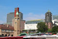 St. Pauli Pier clock tower with buildings along Bernhard-Nocht on hill beyond. Hamburg, Germany.