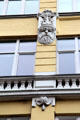 Carving details of yellow building at foot of Ditmar-Koel-Straße. Hamburg, Germany.