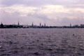Hamburg skyline across the Aussenalster Lake punctuated by the city's five spires. Hamburg, Germany.