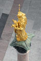 Golden statue of Jesus & Mary atop Marien column at Neues Rathaus. Munich, Germany.