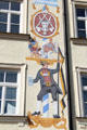 Pole with beer history from Roman to German times wall painting by Bertram Müller at Viktualienmarkt. Munich, Germany.