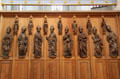 Wall with carved saints over statues of bishops at Frauenkirche. Munich, Germany.